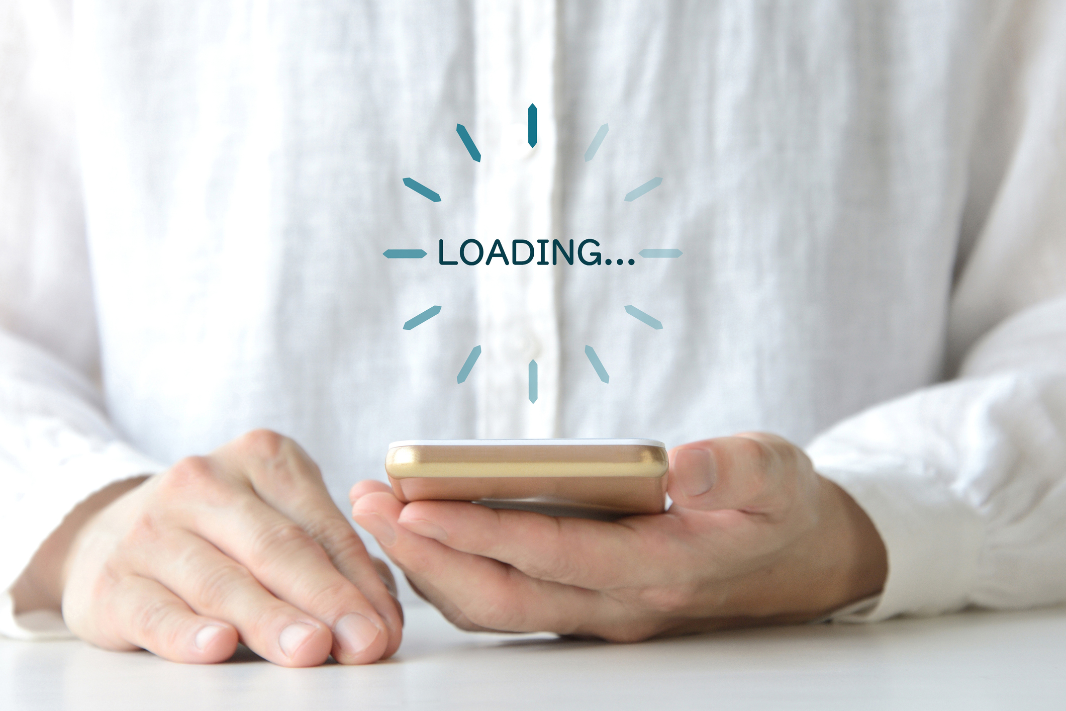 Image of a person waiting for the loading screen on their smartphone