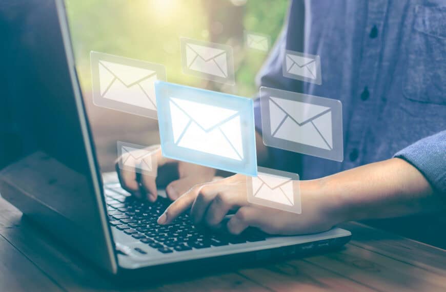 Business man hand working on Laptop with email illustration. email marketing concept, company sending many emails or digital newsletter to customers. newsletter online.