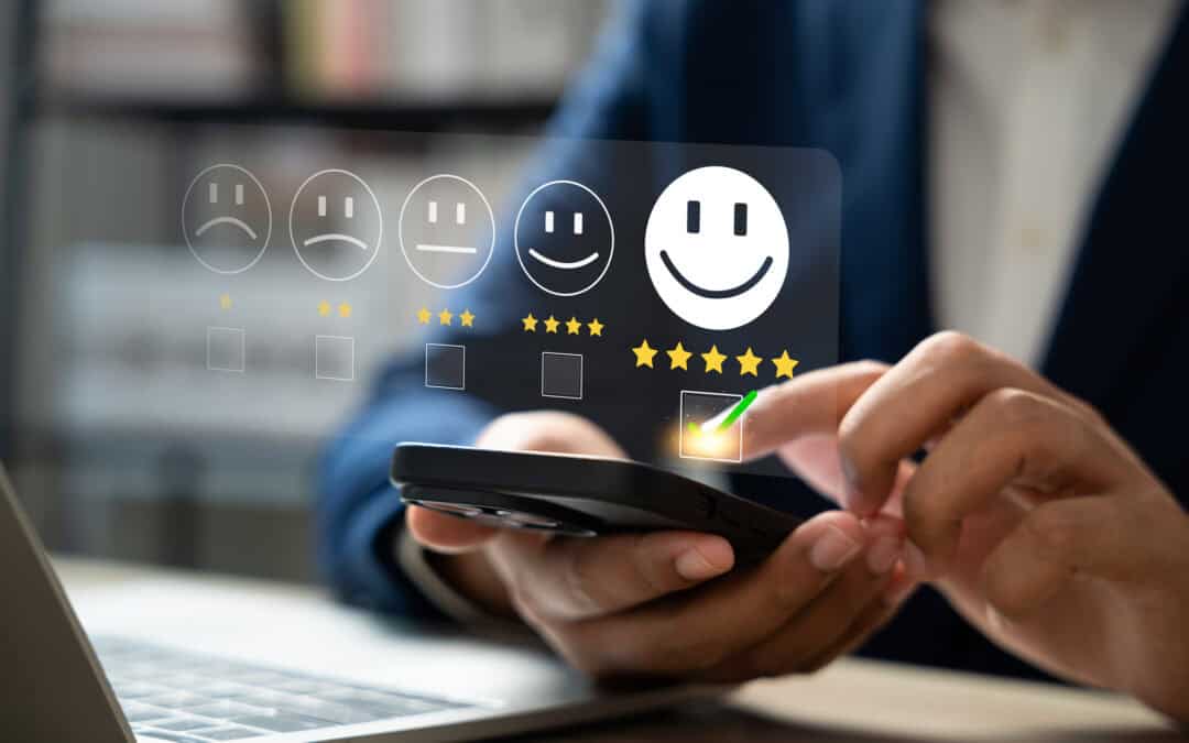 Positive customer review concept; Person using a smartphone to rate small business from one star to five.