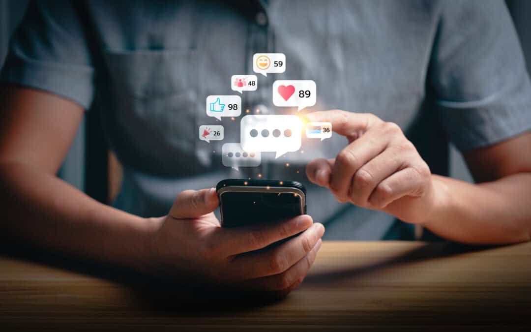 Social media interaction and online engagement concept with smartphone notifications. User touching screen to respond to likes, messages, and comments. Social media marketing concept.