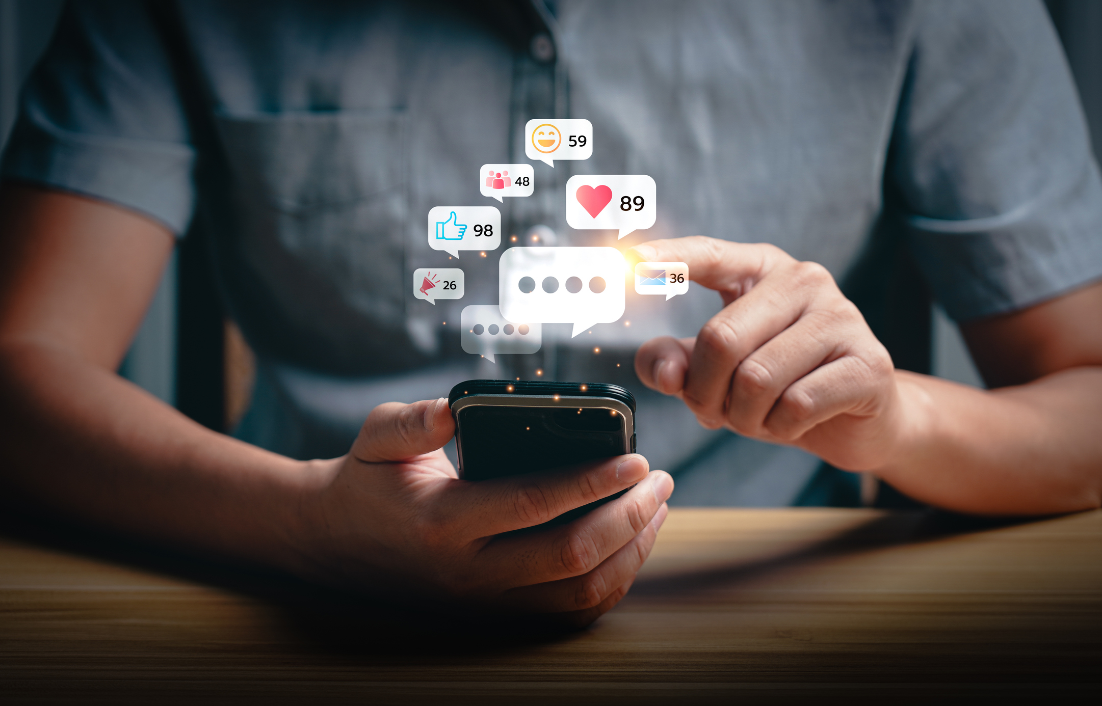 Social media interaction and online engagement concept with smartphone notifications. User touching screen to respond to likes, messages, and comments. Social media marketing concept.